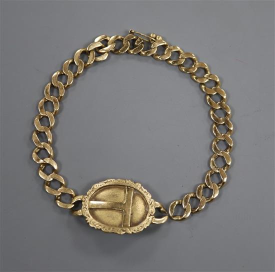 A yellow metal mounted curblink bracelet with engraved oval plaque(a.f.),